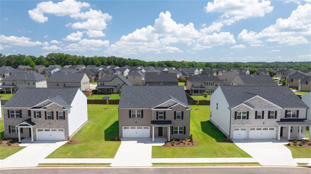 an aerial view of a house with a big yard
