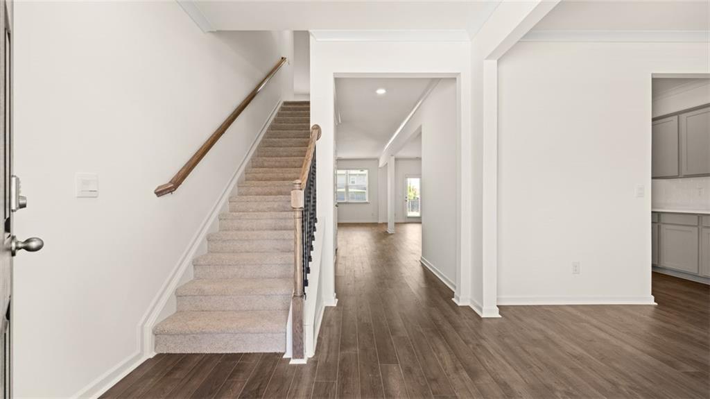 71 Weymouth Drive Locust Grove, GA 30248 - Photo 20 of 56 a view of a hallway with wooden floor and entryway