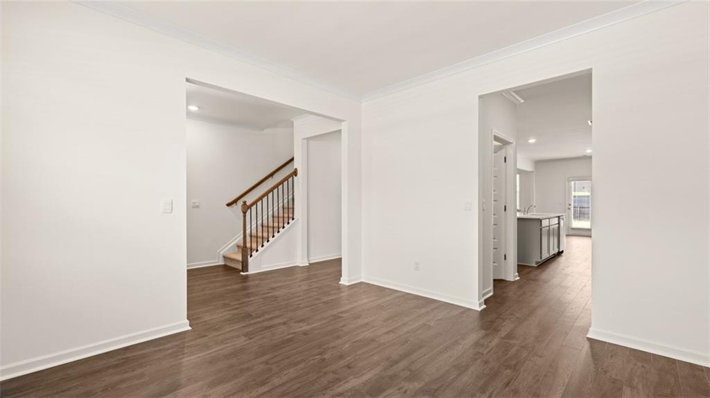 71 Weymouth Drive Locust Grove, GA 30248 - Photo 24 of 56 a view of an empty room with wooden floor and a window