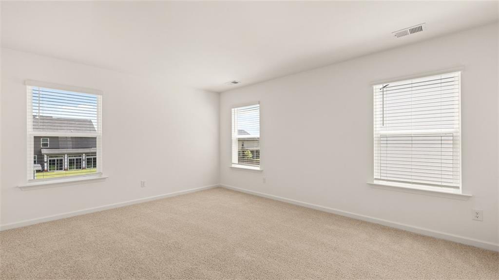71 Weymouth Drive Locust Grove, GA 30248 - Photo 31 of 56 an empty room with a window