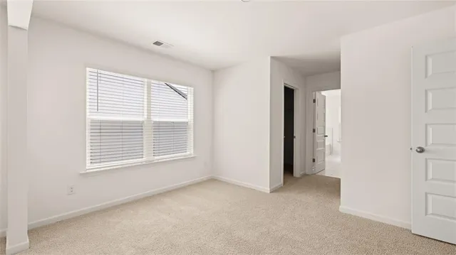 a bathroom with double sink and a mirror