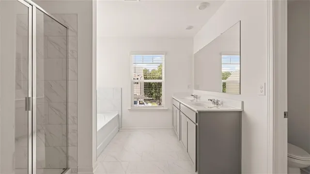 a bathroom with a glass shower door