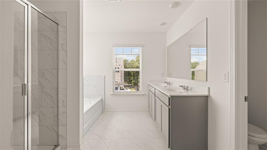 71 Weymouth Drive Locust Grove, GA 30248 - Photo 35 of 56 a view of room with bathroom and windows