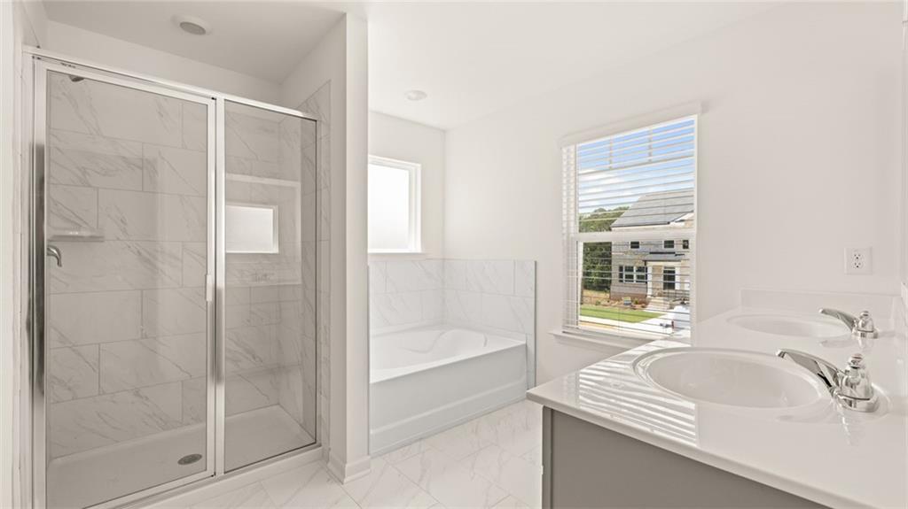 71 Weymouth Drive Locust Grove, GA 30248 - Photo 36 of 56 a bathroom with a sink and a bathtub