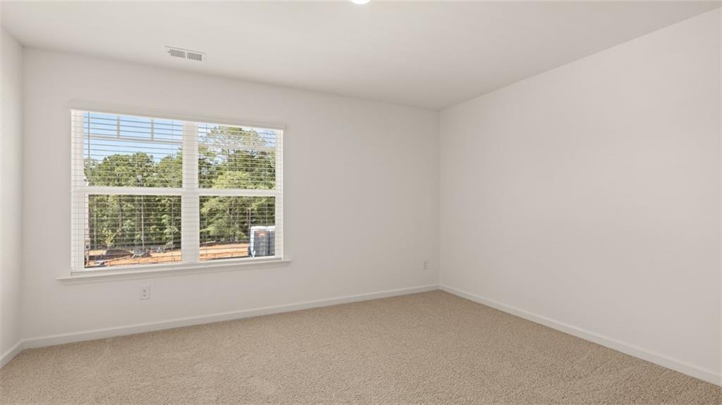 71 Weymouth Drive Locust Grove, GA 30248 - Photo 45 of 56 an empty room with a window