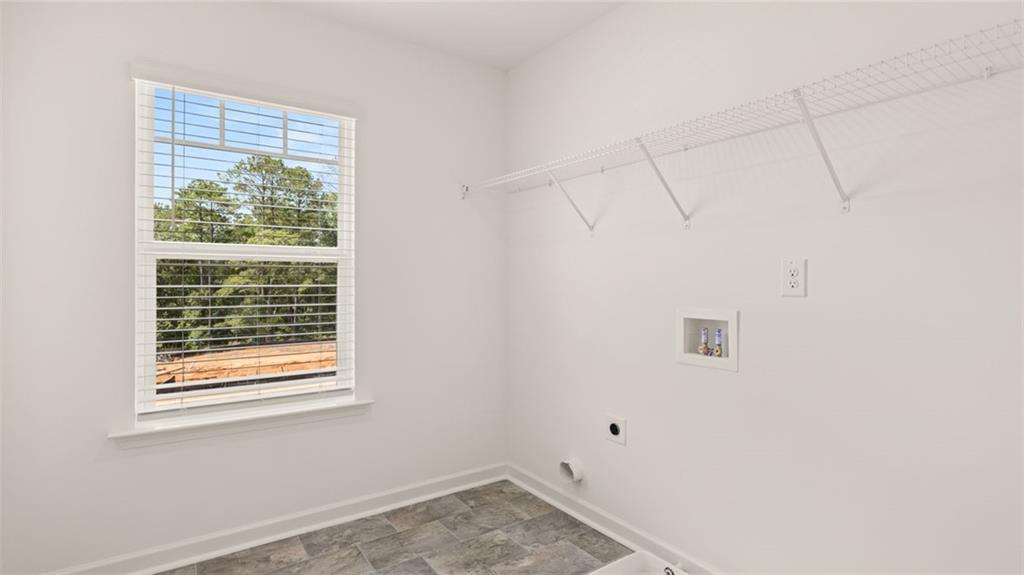 71 Weymouth Drive Locust Grove, GA 30248 - Photo 52 of 56 a view of a room that has a window in it