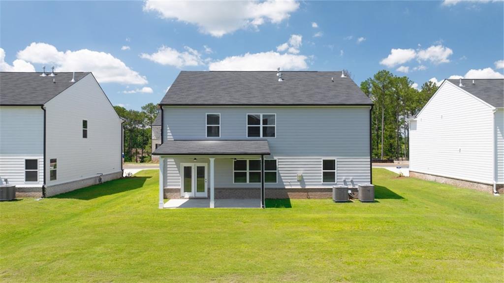 71 Weymouth Drive Locust Grove, GA 30248 - Photo 55 of 56 a front view of house with yard and seating area