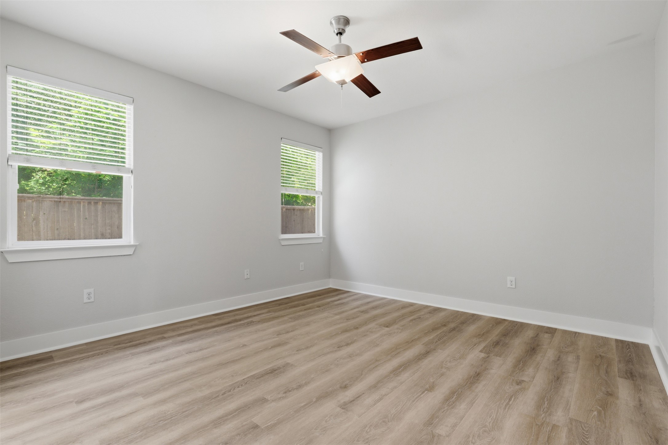 7208 Lysander Court Austin, TX 78741 - Photo 9 of 15 wooden floor in an empty room with a window
