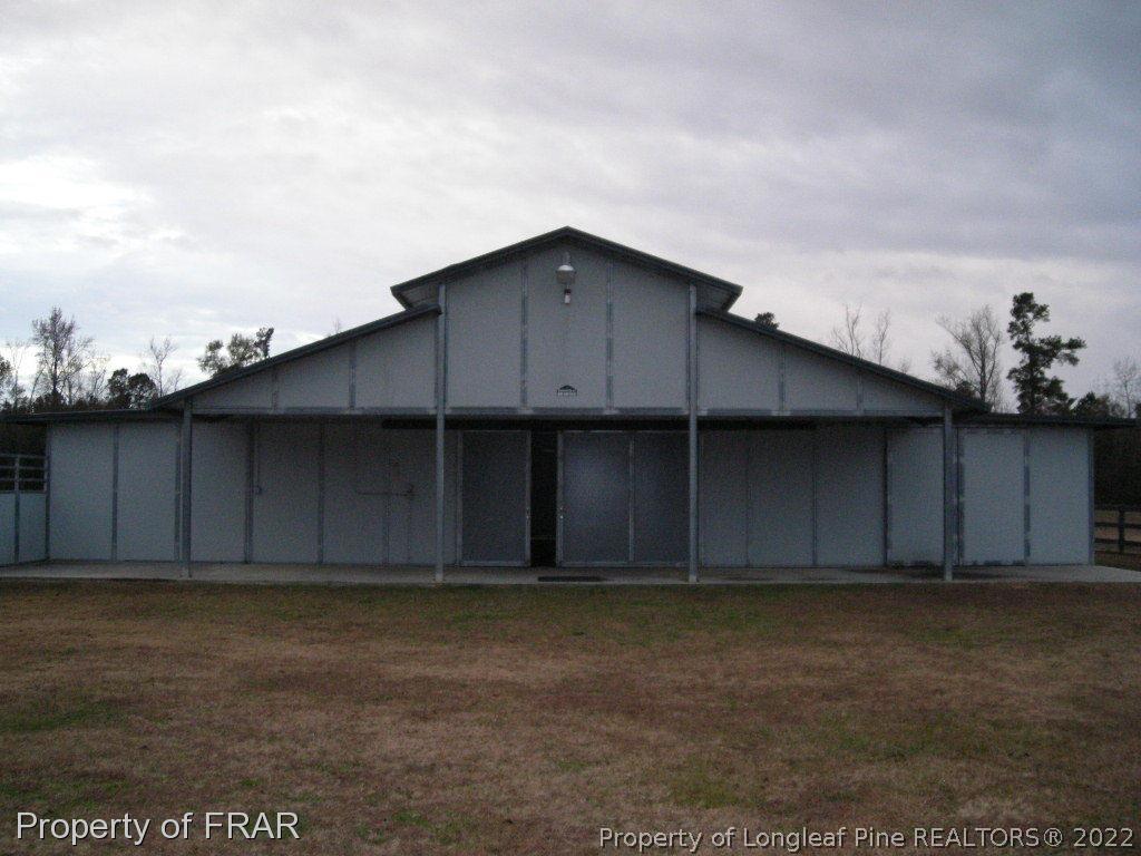 5310 Lovette Road Orrum, NC 28369 - Photo 1 of 31 a backyard of a house