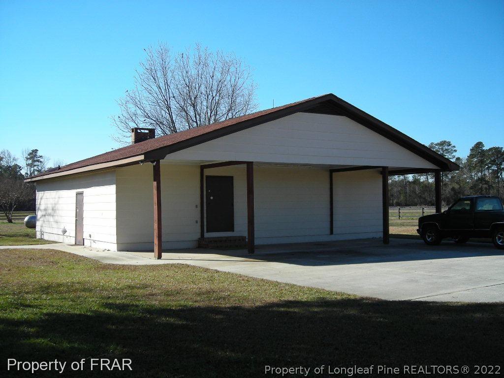 5310 Lovette Road Orrum, NC 28369 - Photo 20 of 31 a front view of a house with a garden