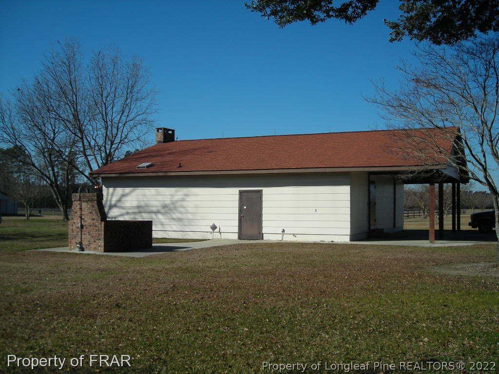 5310 Lovette Road Orrum, NC 28369 - Photo 21 of 31 a front view of a house with a yard