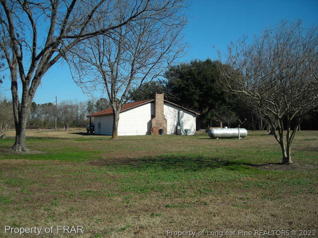 5310 Lovette Road Orrum, NC 28369 - Photo 22 of 31 a view of backyard with green space