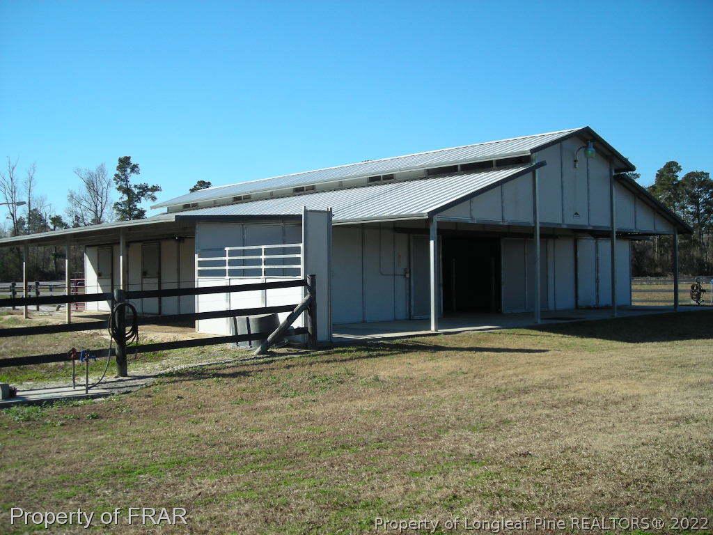 5310 Lovette Road Orrum, NC 28369 - Photo 23 of 31 a front view of a house with a yard