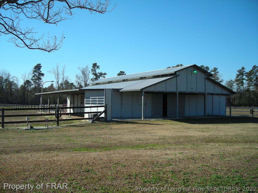 5310 Lovette Road Orrum, NC 28369 - Photo 28 of 31 a view of a house with a yard
