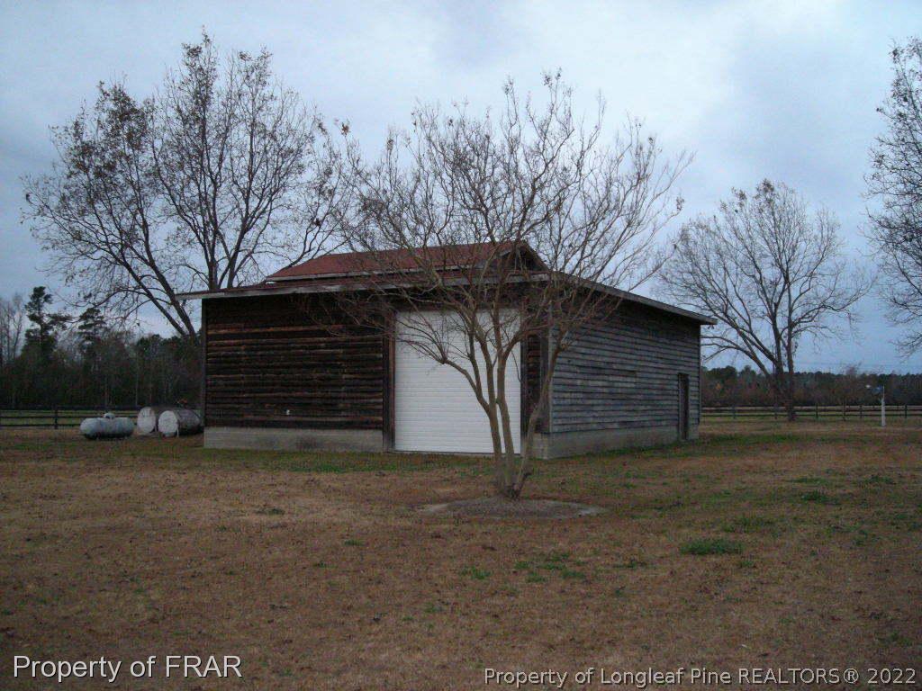 5310 Lovette Road Orrum, NC 28369 - Photo 4 of 31 a view of a house with a yard