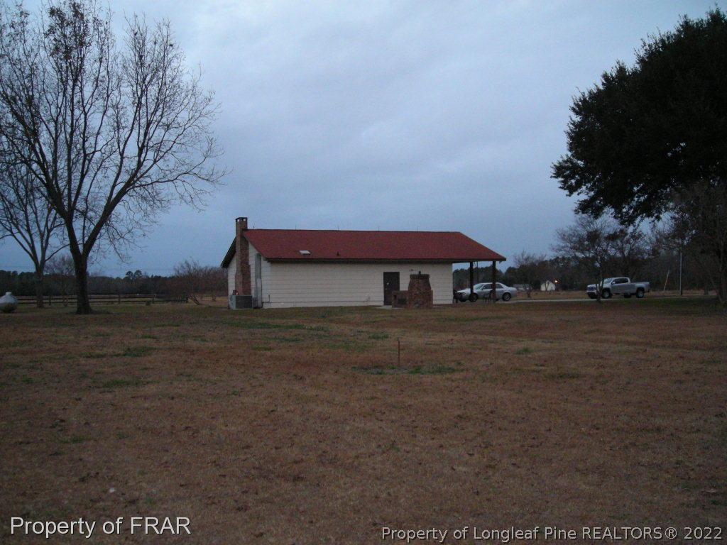 5310 Lovette Road Orrum, NC 28369 - Photo 5 of 31 a view of a house with a yard