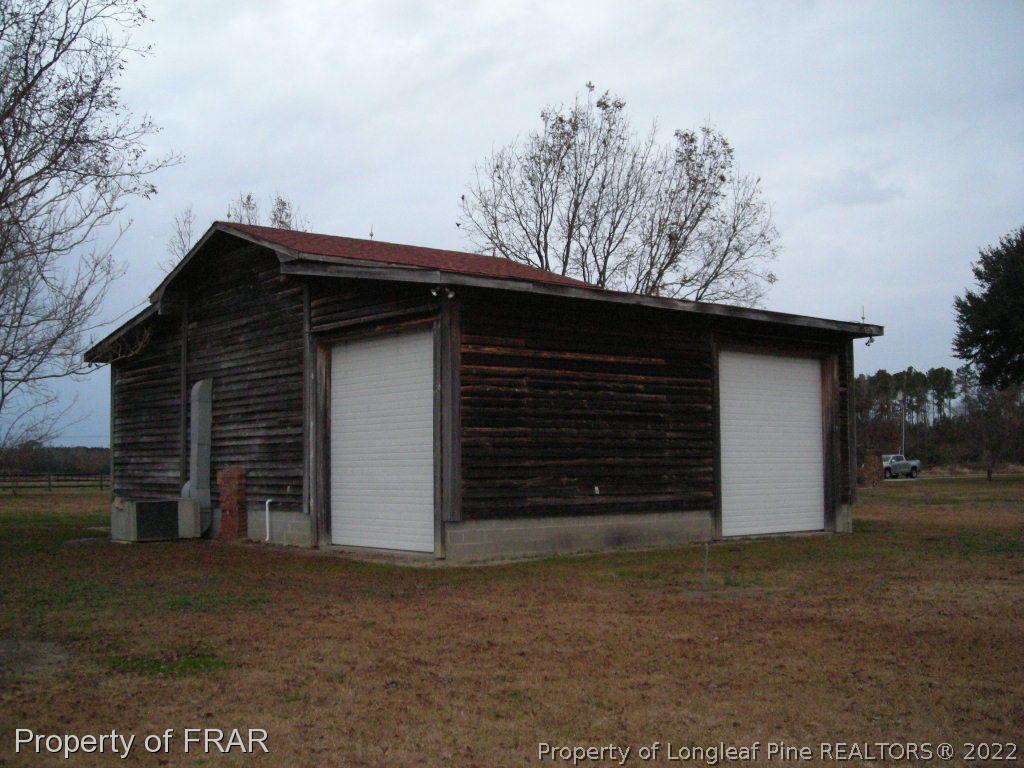 5310 Lovette Road Orrum, NC 28369 - Photo 7 of 31 a backyard of a house