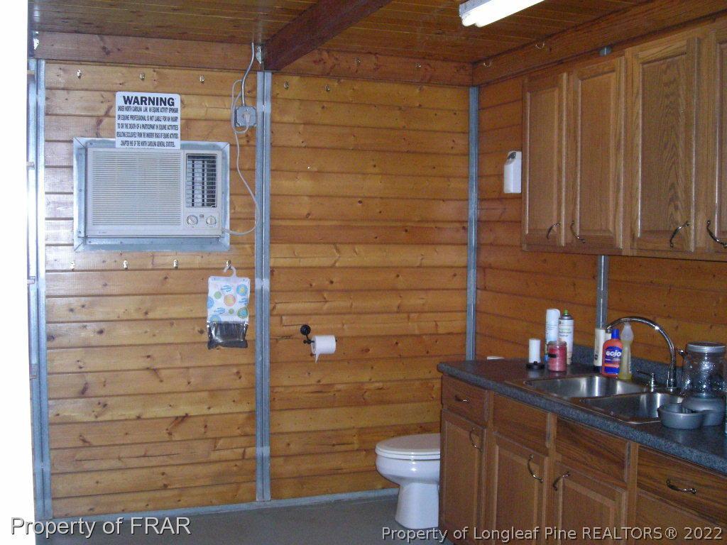 5310 Lovette Road Orrum, NC 28369 - Photo 10 of 31 a bathroom with a toilet and a sink