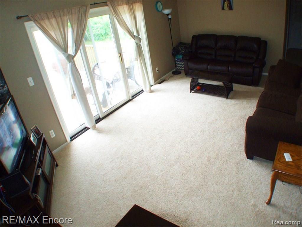 5075 Maybee Road Clarkston, MI 48346 - Photo 3 of 13 Comfy family room, big enough for two couches plus more