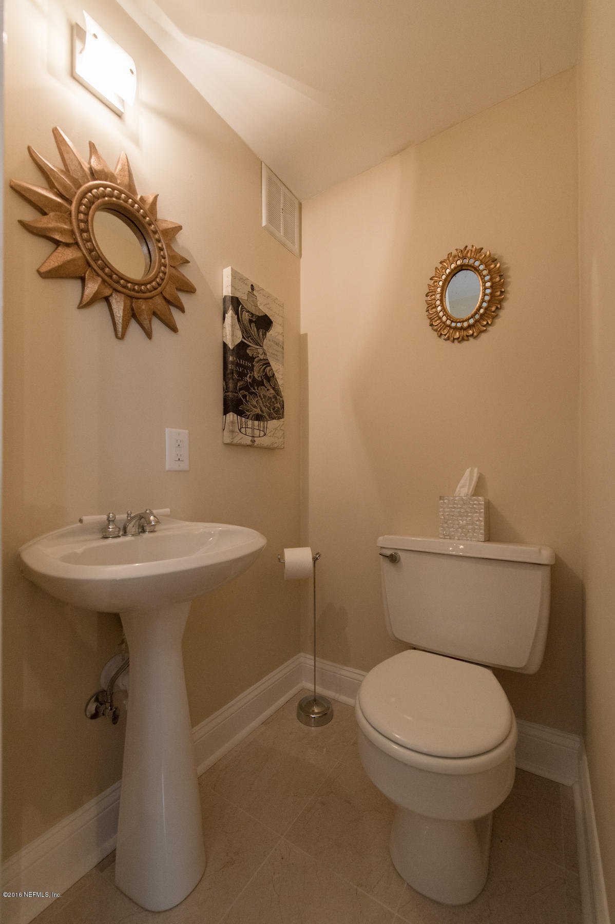 824 South Shores Road Jacksonville, FL 32207 - Photo 11 of 19 a bathroom with a sink a toilet and mirror