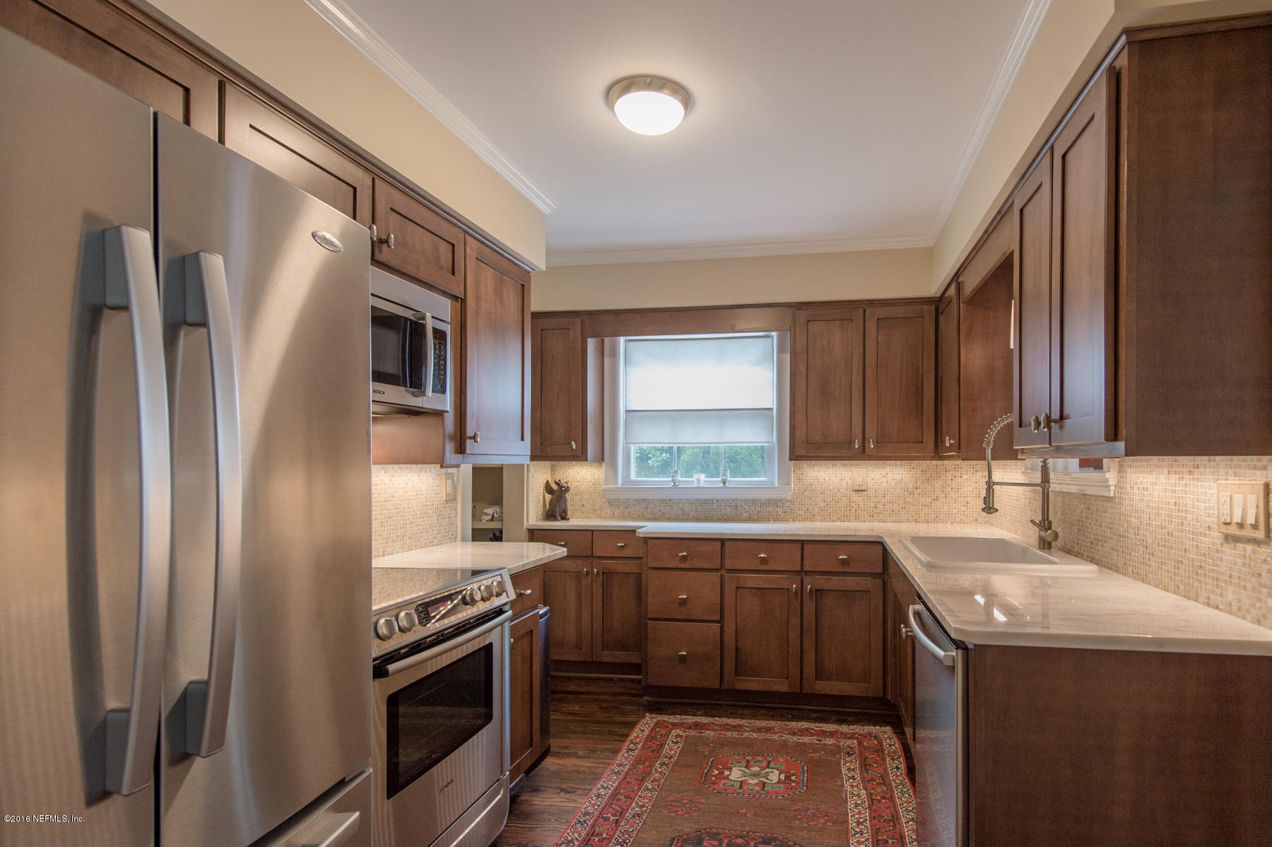 824 South Shores Road Jacksonville, FL 32207 - Photo 8 of 19 a kitchen that has a sink stainless steel appliances and cabinets