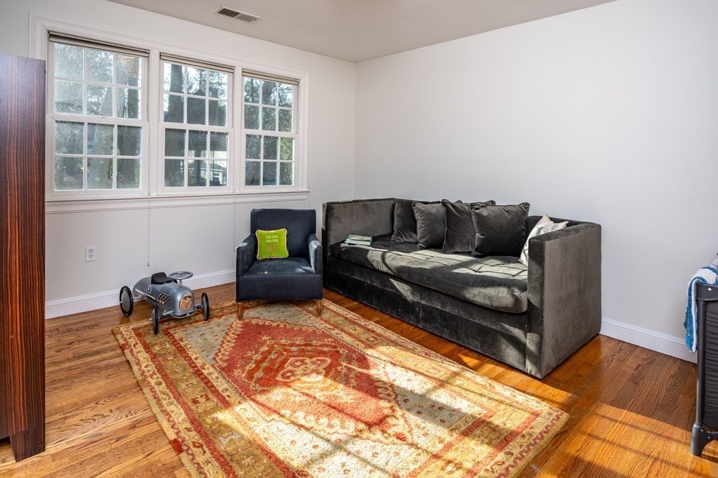 18 Fox Hill Road Newton, MA 02459 - Photo 24 of 37 a living room with furniture and a flat screen tv