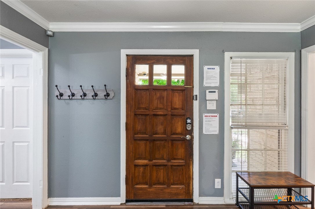1609 South 39th Street Temple, TX 76504 - Photo 3 of 19 a view of a room with cabinet wooden floor and windows