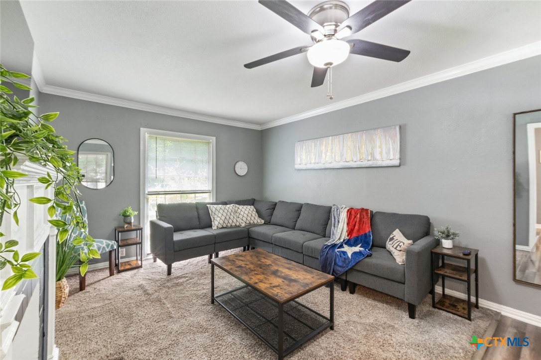 1609 South 39th Street Temple, TX 76504 - Photo 5 of 19 a living room with furniture and a large window