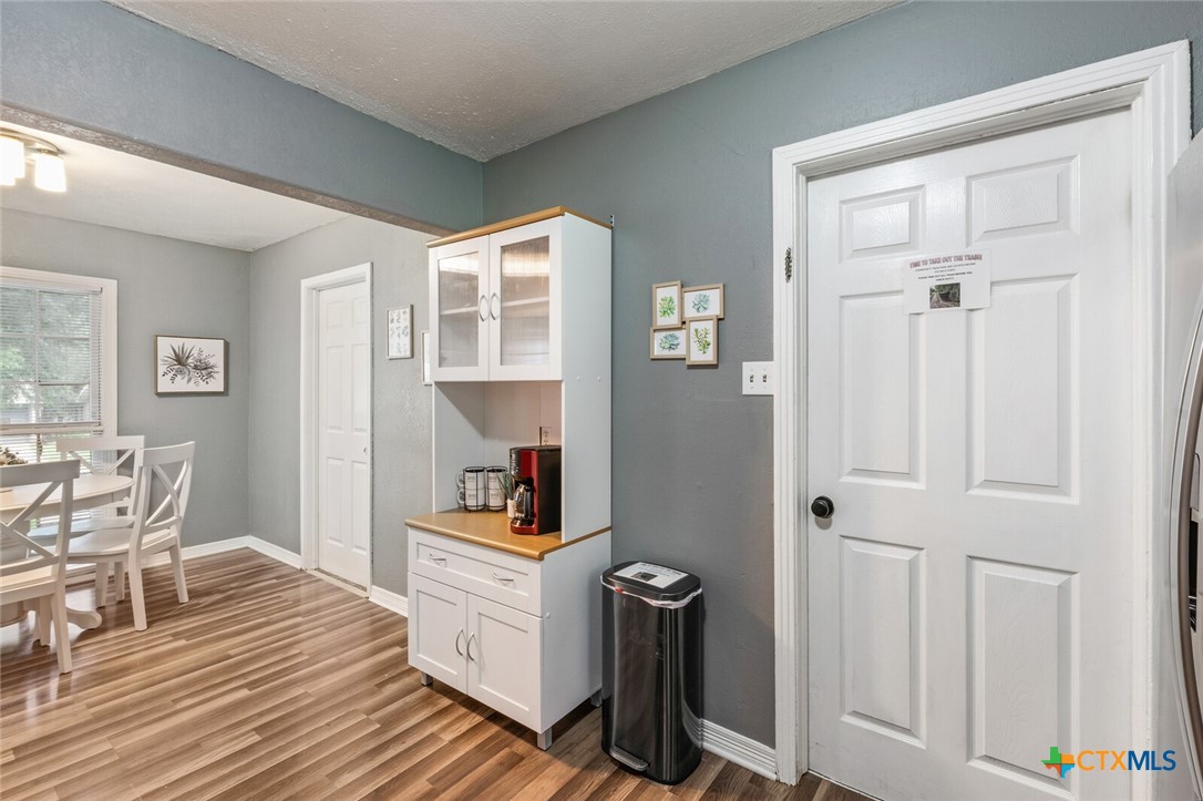 1609 South 39th Street Temple, TX 76504 - Photo 9 of 19 a room with furniture and wooden floor