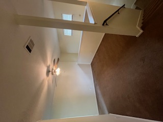14909 Nuttall Drive Austin, TX 78724 - Photo 8 of 13 Unfurnished room with dark carpet and a ceiling fan