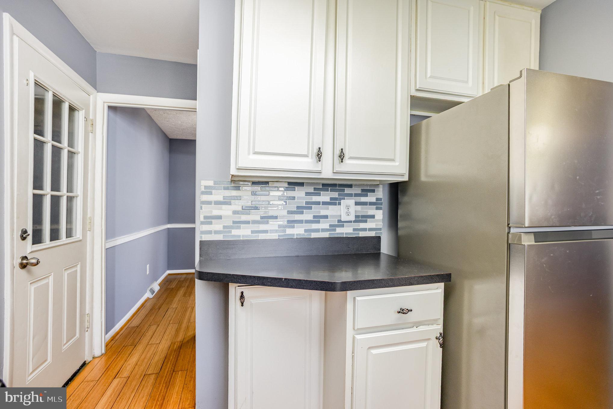 615 Pinehurst Street Aberdeen, MD 21001 - Photo 11 of 39 a kitchen with appliances cabinets and a window
