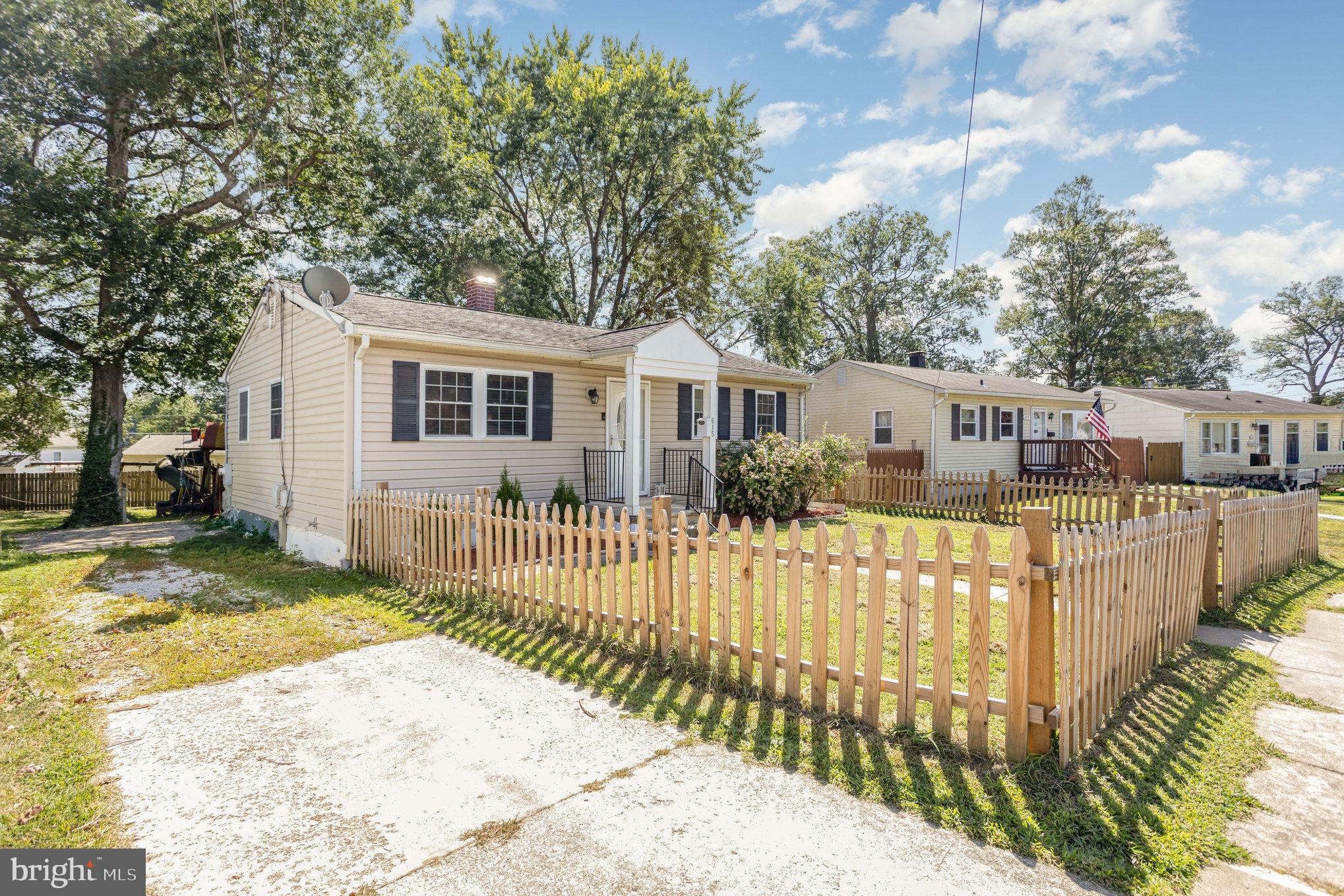 615 Pinehurst Street Aberdeen, MD 21001 - Photo 2 of 39 a front view of a house with a wooden fence