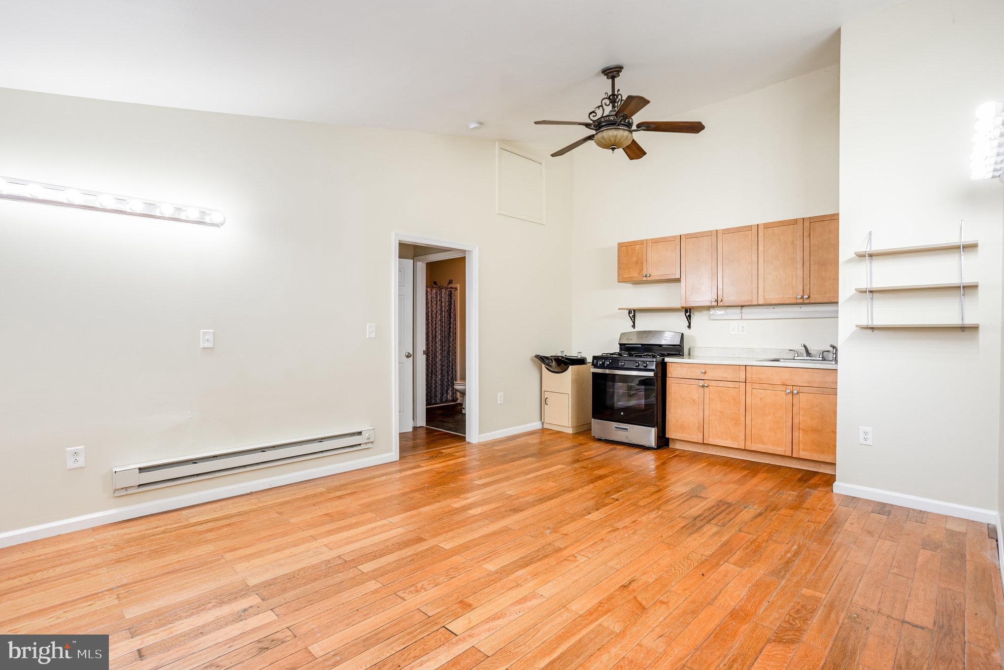 615 Pinehurst Street Aberdeen, MD 21001 - Photo 22 of 39 a kitchen with granite countertop a stove and a refrigerator