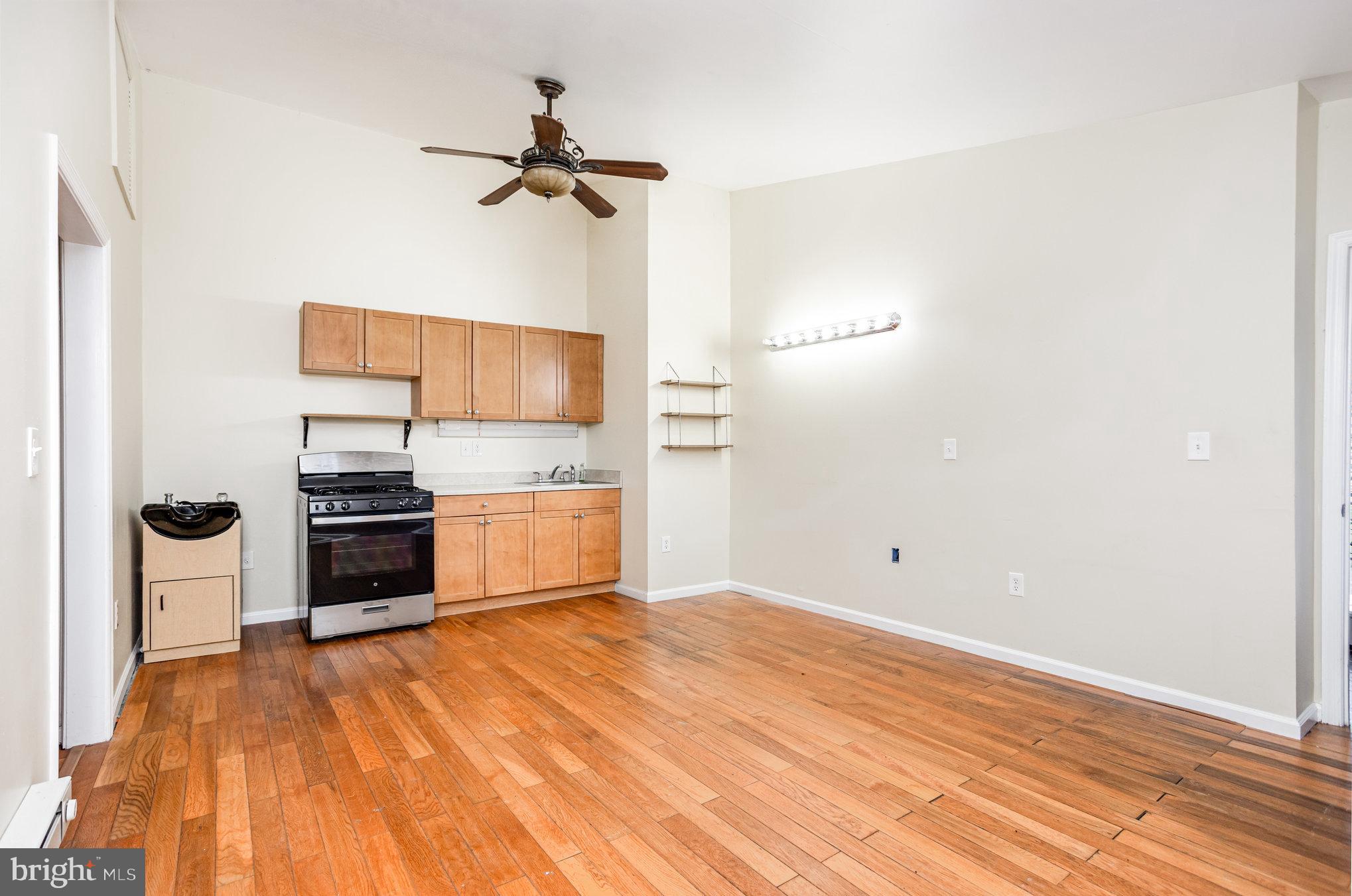 615 Pinehurst Street Aberdeen, MD 21001 - Photo 23 of 39 a kitchen with a refrigerator and a stove top oven