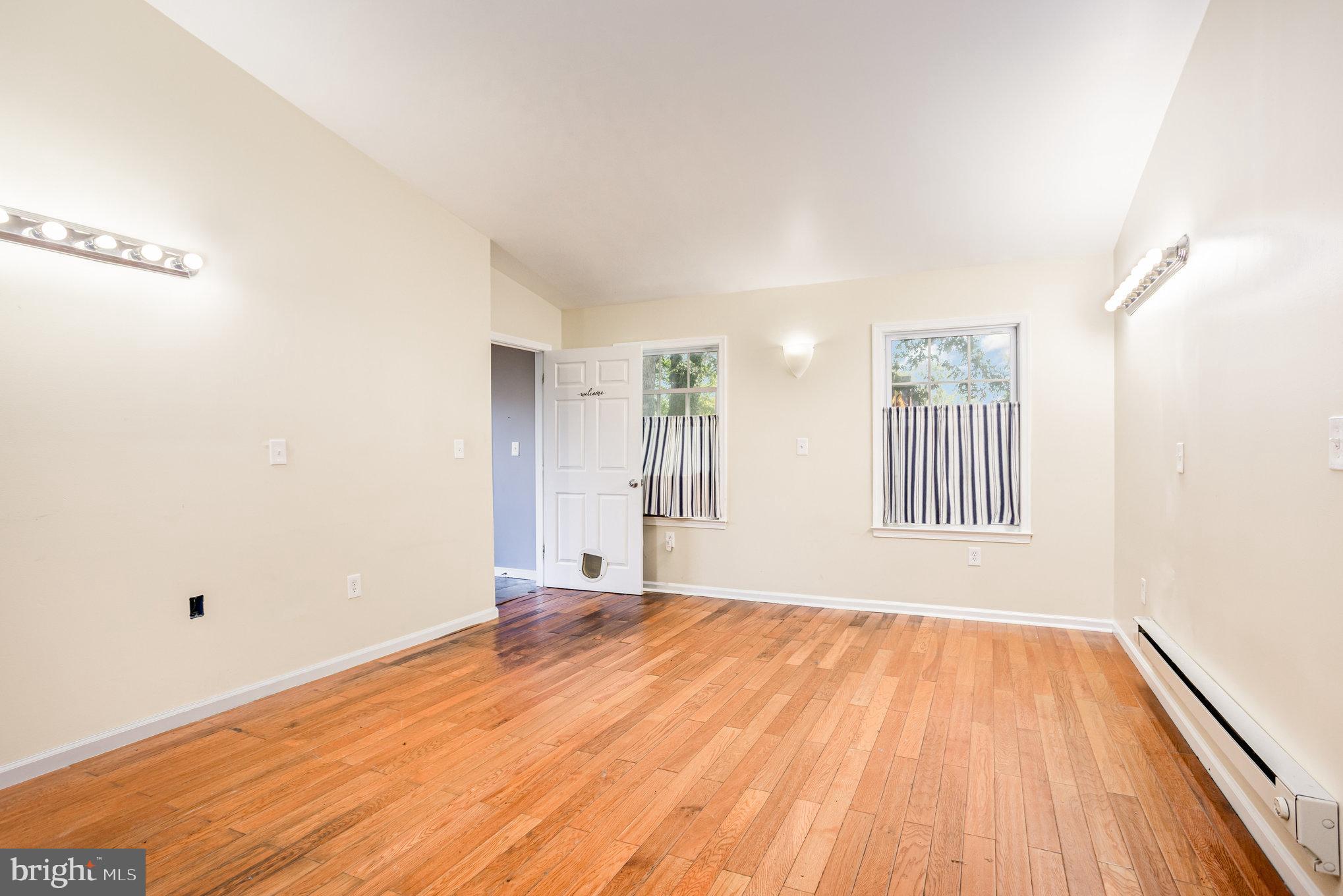615 Pinehurst Street Aberdeen, MD 21001 - Photo 24 of 39 a view of an empty room with wooden floor and a window
