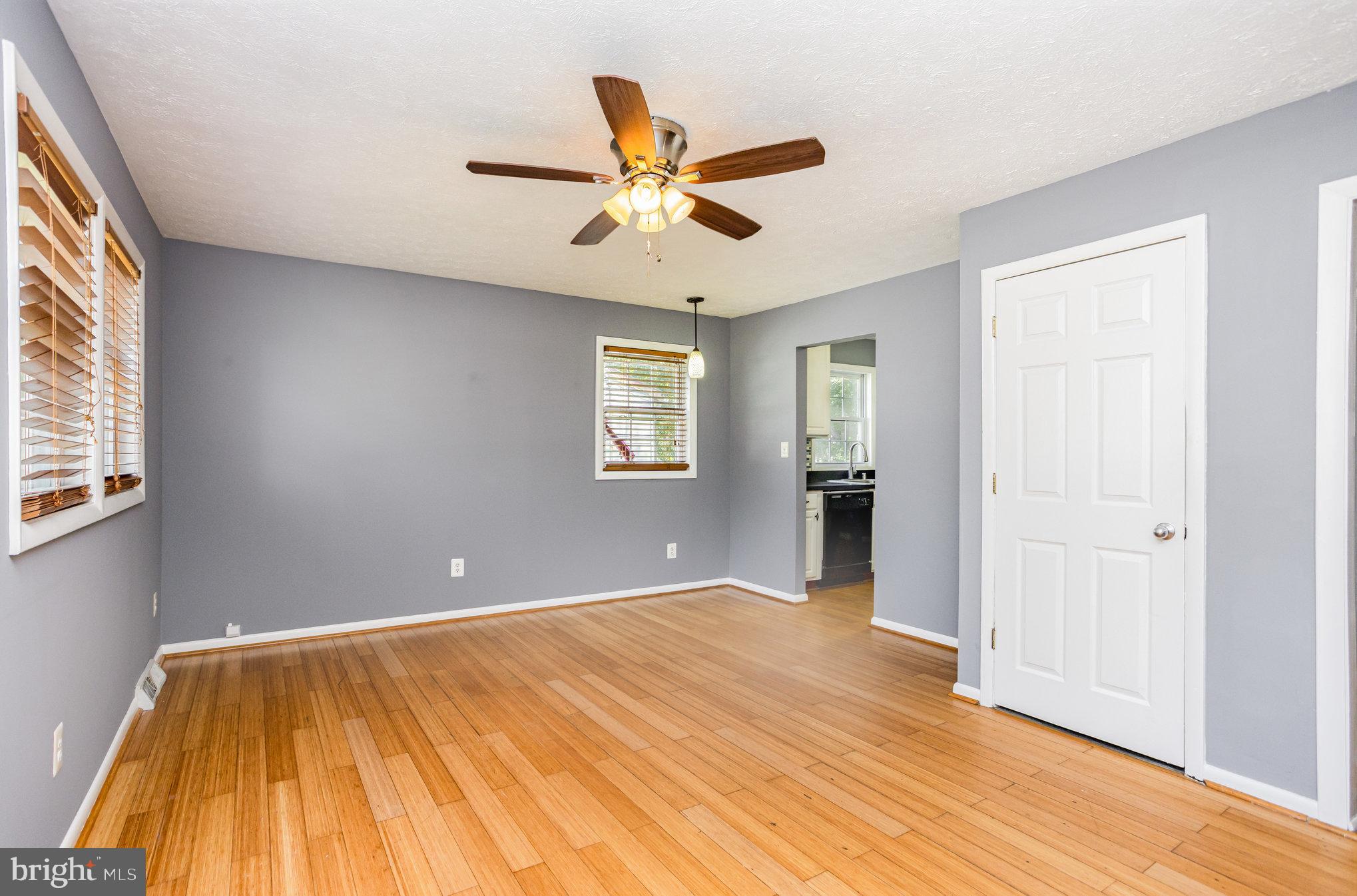 615 Pinehurst Street Aberdeen, MD 21001 - Photo 7 of 39 a view of an empty room with window and a kitchen