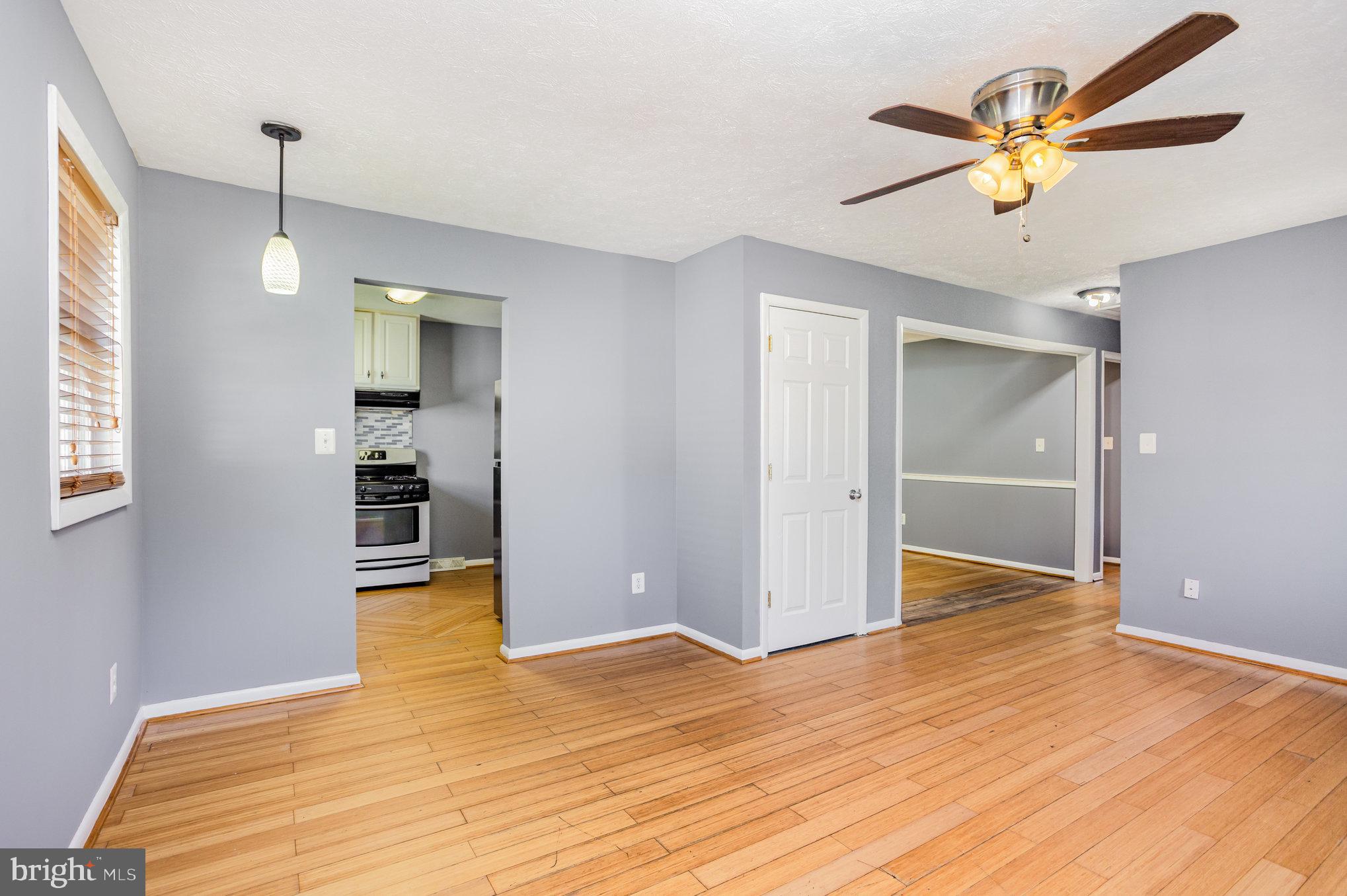 615 Pinehurst Street Aberdeen, MD 21001 - Photo 8 of 39 a view of empty room with wooden floor and fan