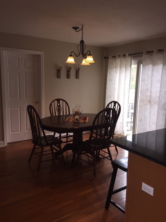10 Baker Pond Road Charlton, MA 01507 - Photo 8 of 21 a view of a dining room with furniture and chandelier