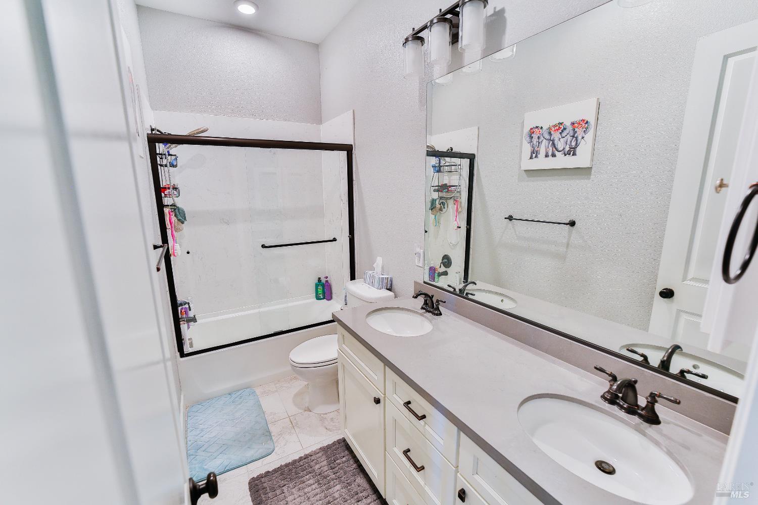 1331 Ridgecrest Court Santa Rosa, CA 95403 - Photo 11 of 19 a bathroom with a double vanity sink mirror and shower