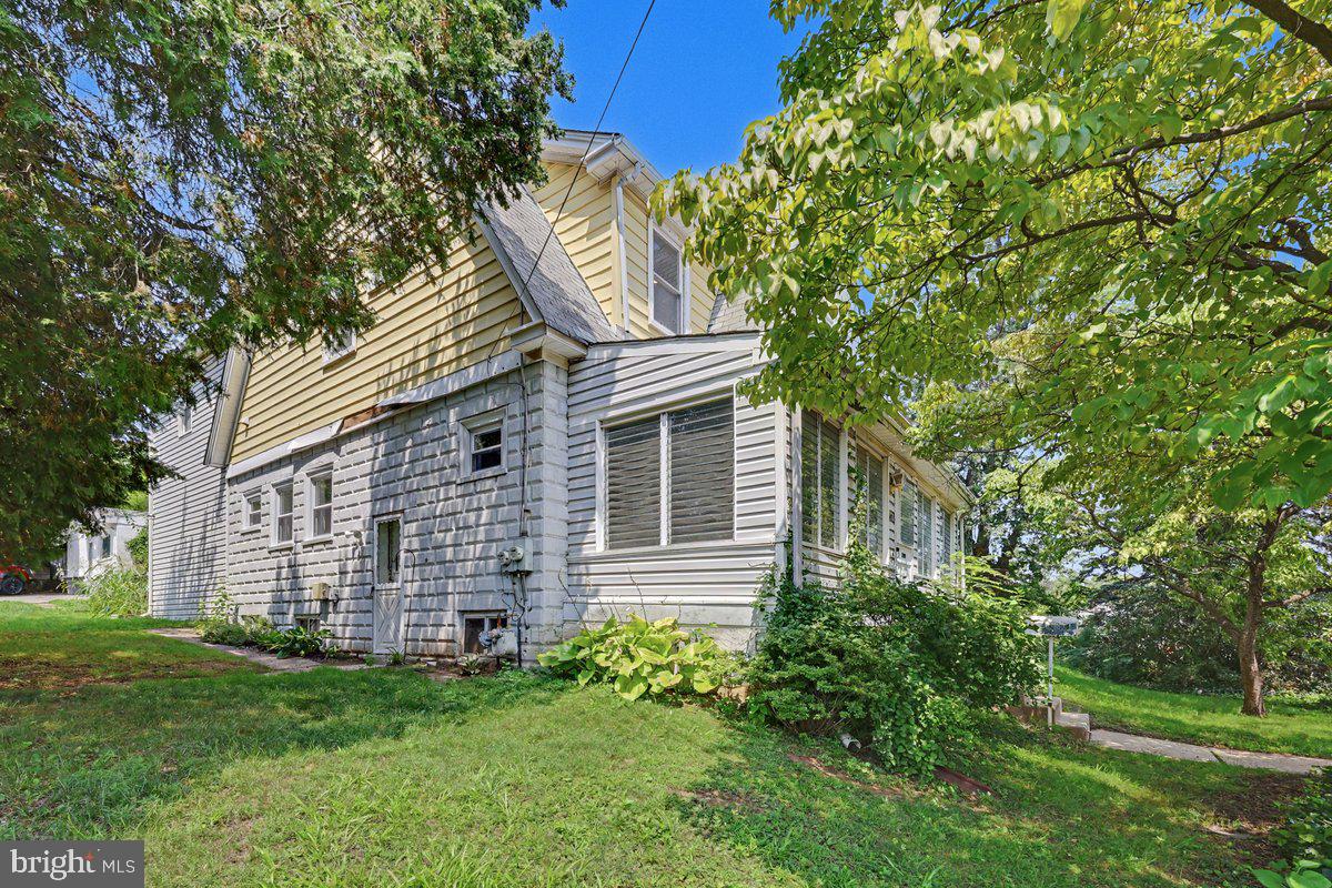 2470 Dutton Mill Road Aston, PA 19014 - Photo 2 of 52 SIDE OF HOUSE AND SUNROOM
