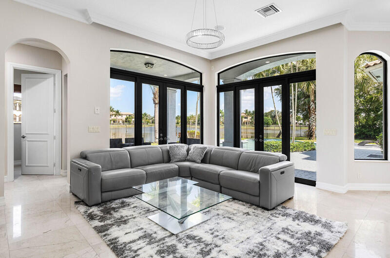 17895 Cadena Drive Boca Raton, FL 33496 - Photo 16 of 49 a living room with furniture and a large window