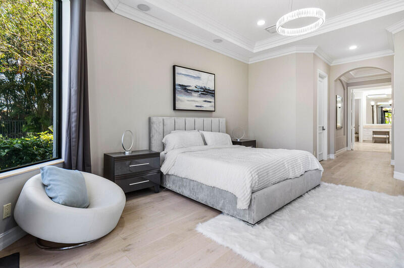 17895 Cadena Drive Boca Raton, FL 33496 - Photo 22 of 49 a bedroom with a bed and a large window