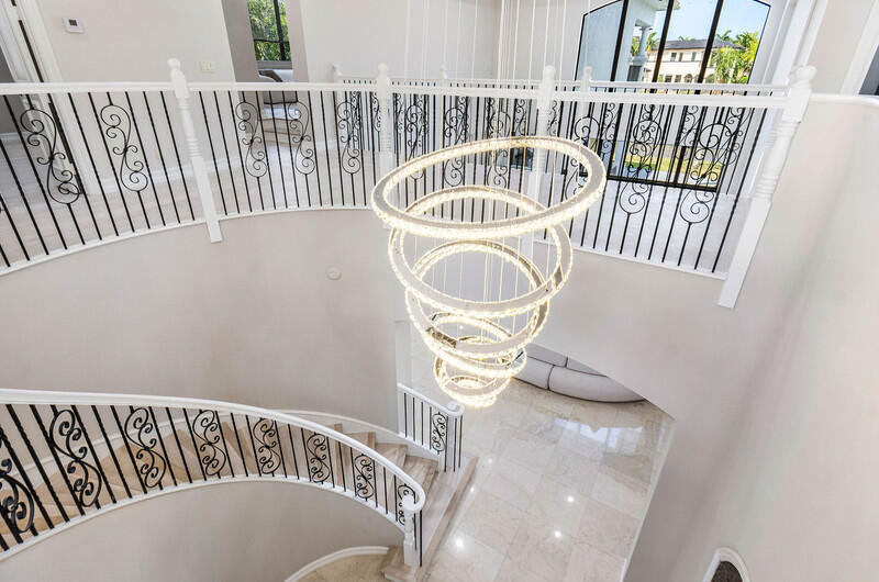 17895 Cadena Drive Boca Raton, FL 33496 - Photo 27 of 49 a view of a bedroom with wooden furniture