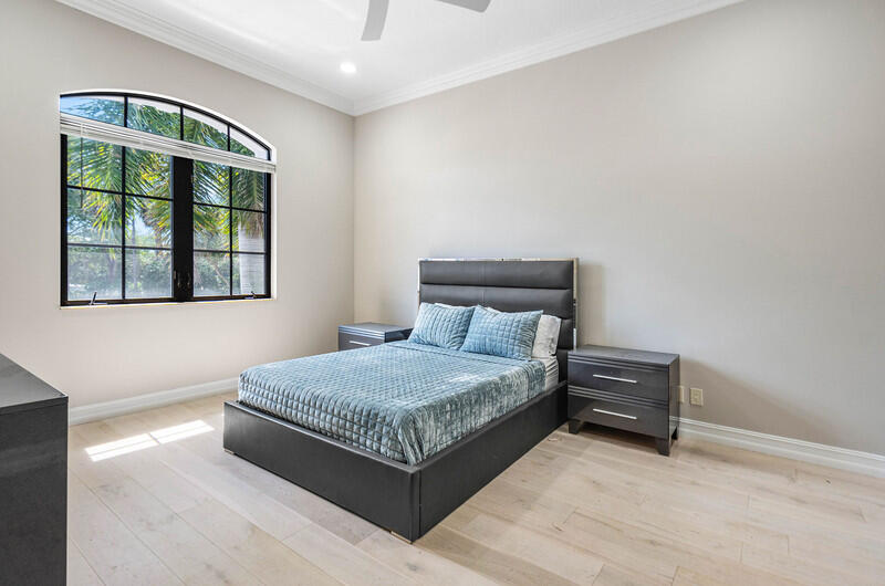 17895 Cadena Drive Boca Raton, FL 33496 - Photo 34 of 49 a bedroom with a bed and window