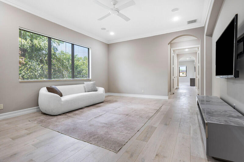 17895 Cadena Drive Boca Raton, FL 33496 - Photo 37 of 49 a living room with furniture and a flat screen tv