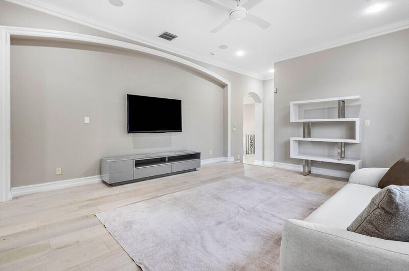 17895 Cadena Drive Boca Raton, FL 33496 - Photo 38 of 49 a living room with furniture and a flat screen tv