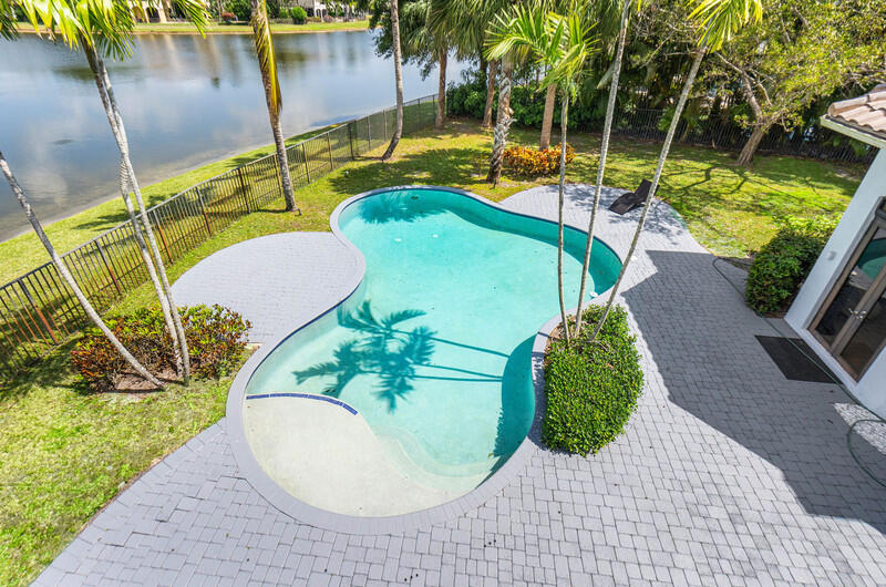 17895 Cadena Drive Boca Raton, FL 33496 - Photo 42 of 49 a view of a swimming pool with a patio
