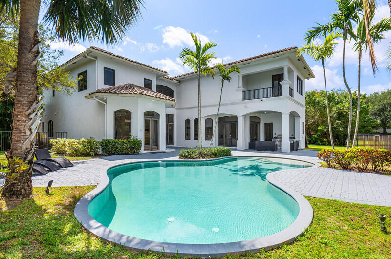 17895 Cadena Drive Boca Raton, FL 33496 - Photo 48 of 49 a view of a house with swimming pool and a small yard
