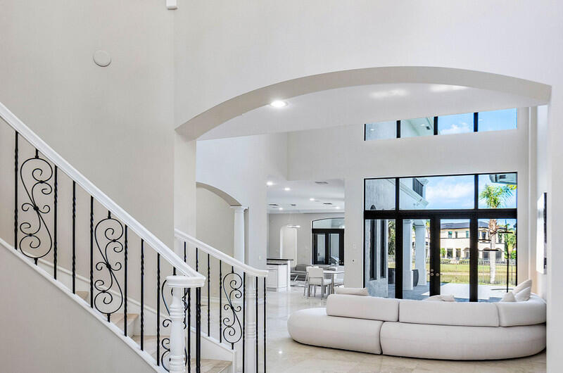 17895 Cadena Drive Boca Raton, FL 33496 - Photo 8 of 49 a living room with furniture and a large window with wooden floor