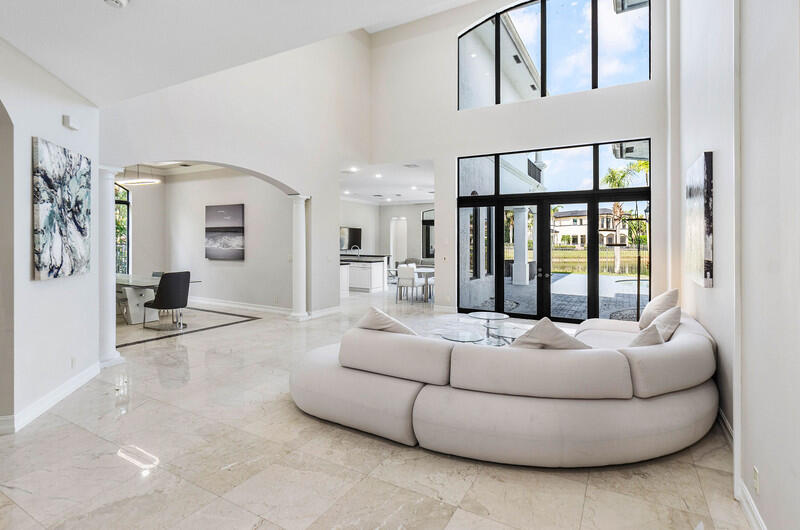 17895 Cadena Drive Boca Raton, FL 33496 - Photo 10 of 49 a living room with furniture and large windows